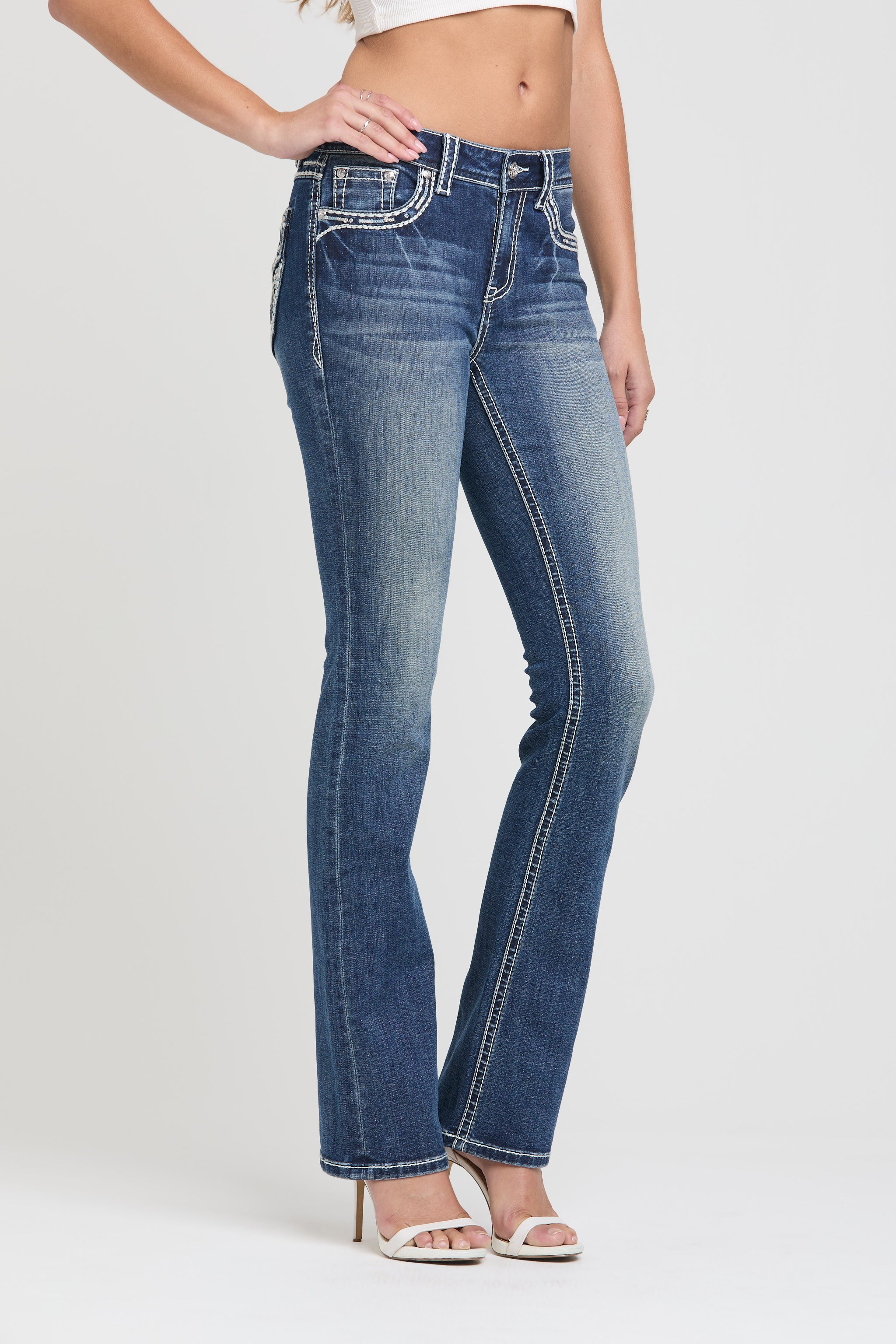 Grace in LA womens flare jeans in faded blue denim with western embroidered pockets and low rise fit.