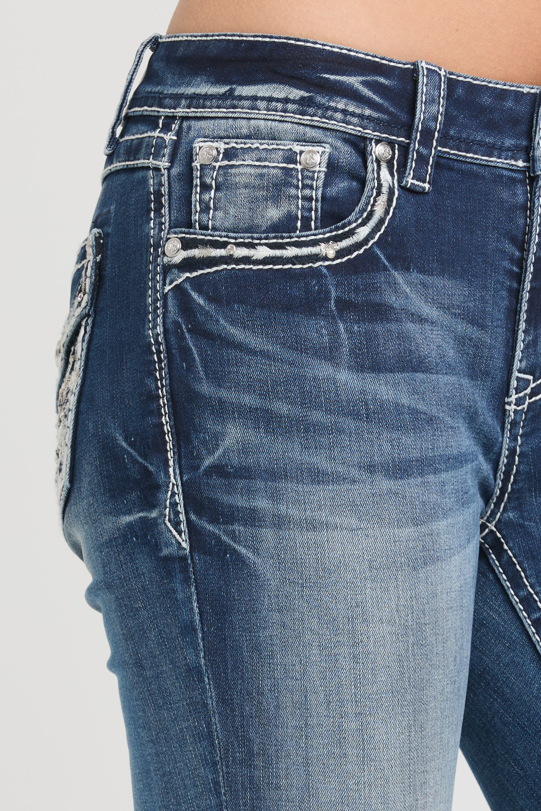 Grace in LA womens bootcut jeans in a dark featuring a side view of the front pocket detailed with white contrast stitching and mini silver crystal rivets.