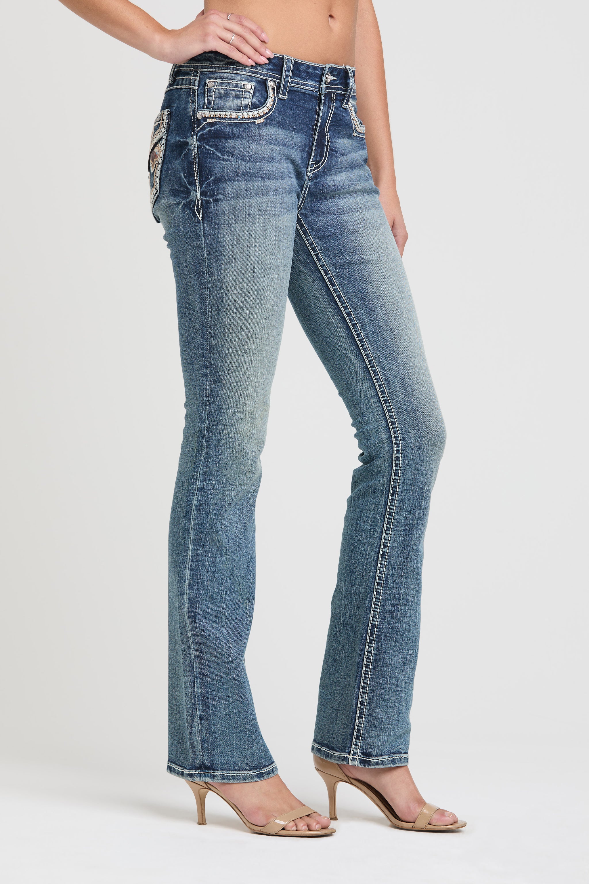 Grace in LA womens bootcut jeans in a medium featuring a slim fit side-profile with white contrast stitching and crystal-embellished pocket details.
