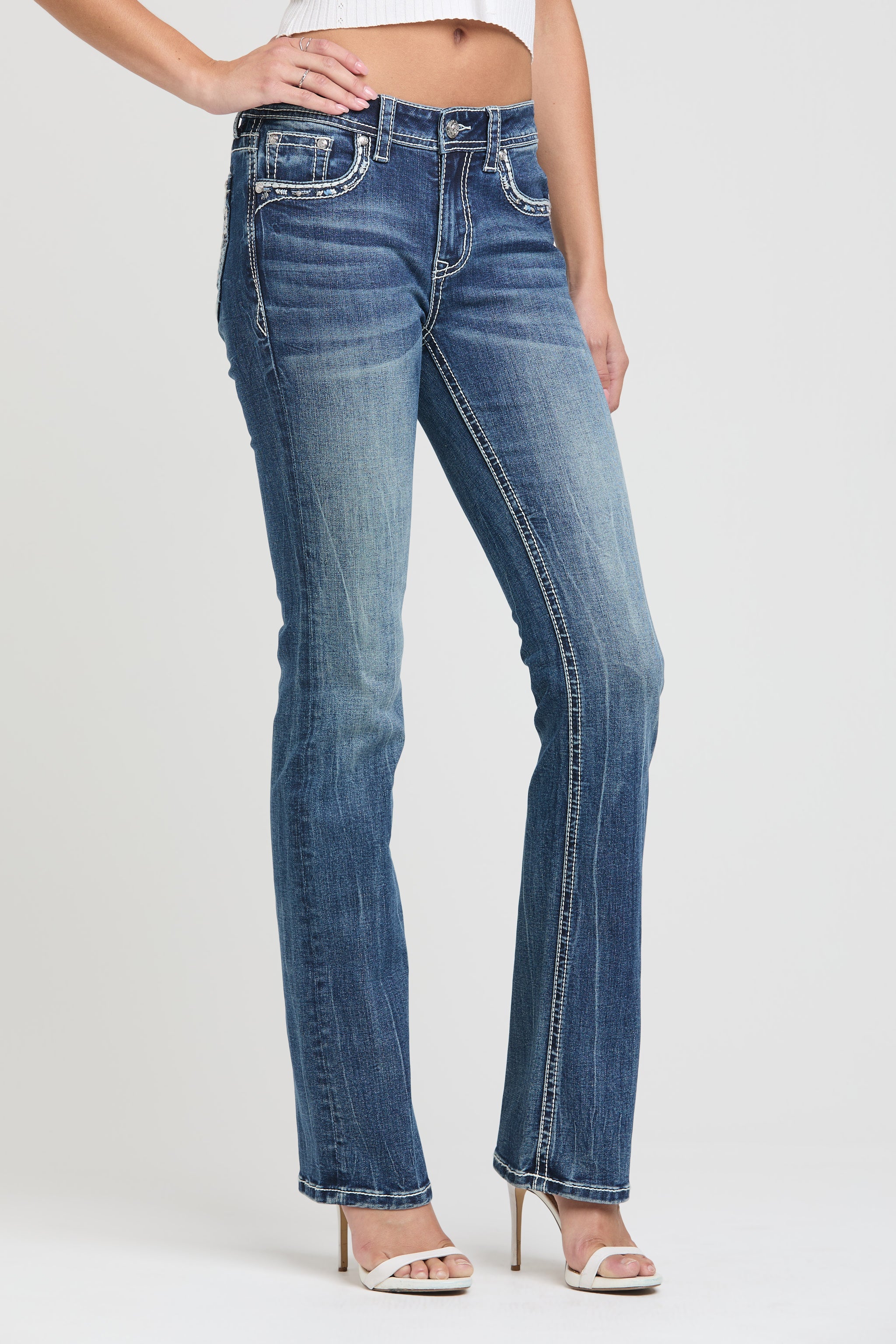Grace in LA womens bootcut jeans in dark with copper sailor button front pocket detailing.