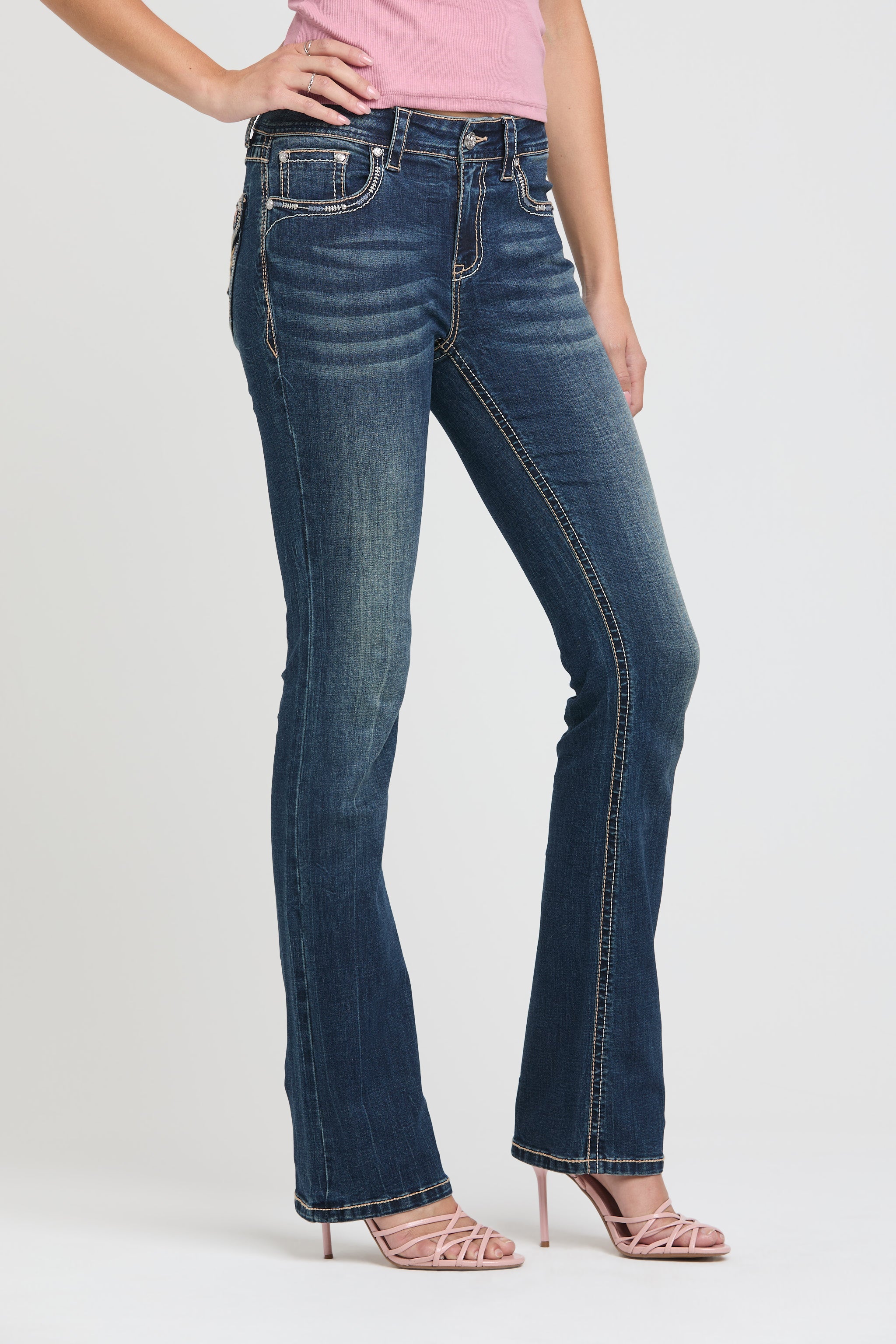 Grace in LA low rise bootcut jeans for women with dark wash denim and signature western embellished stitching.
