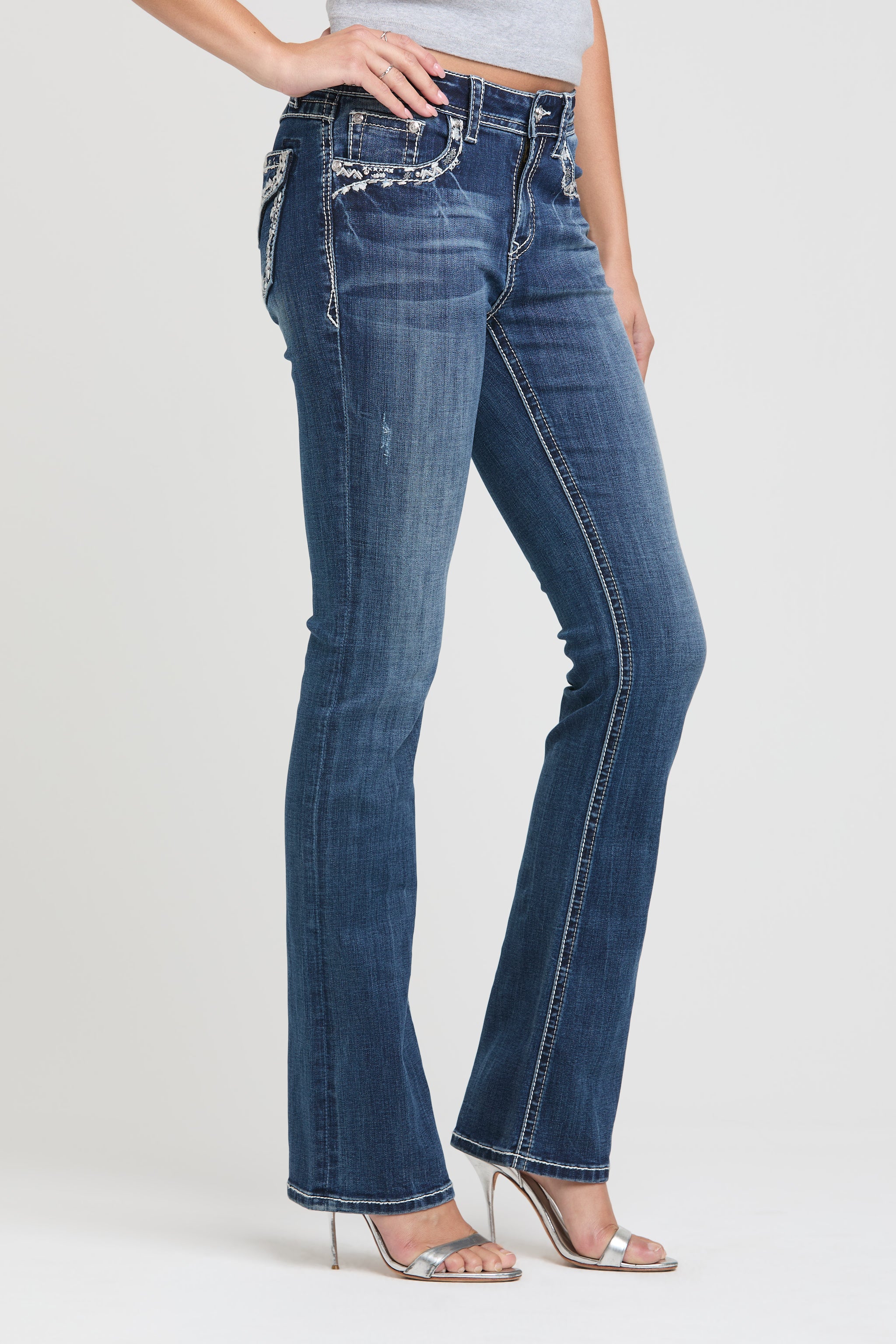 Grace in LA womens bootcut jeans Full-length side profile showcasing the fit and leg shape with white floral pocket detailing.