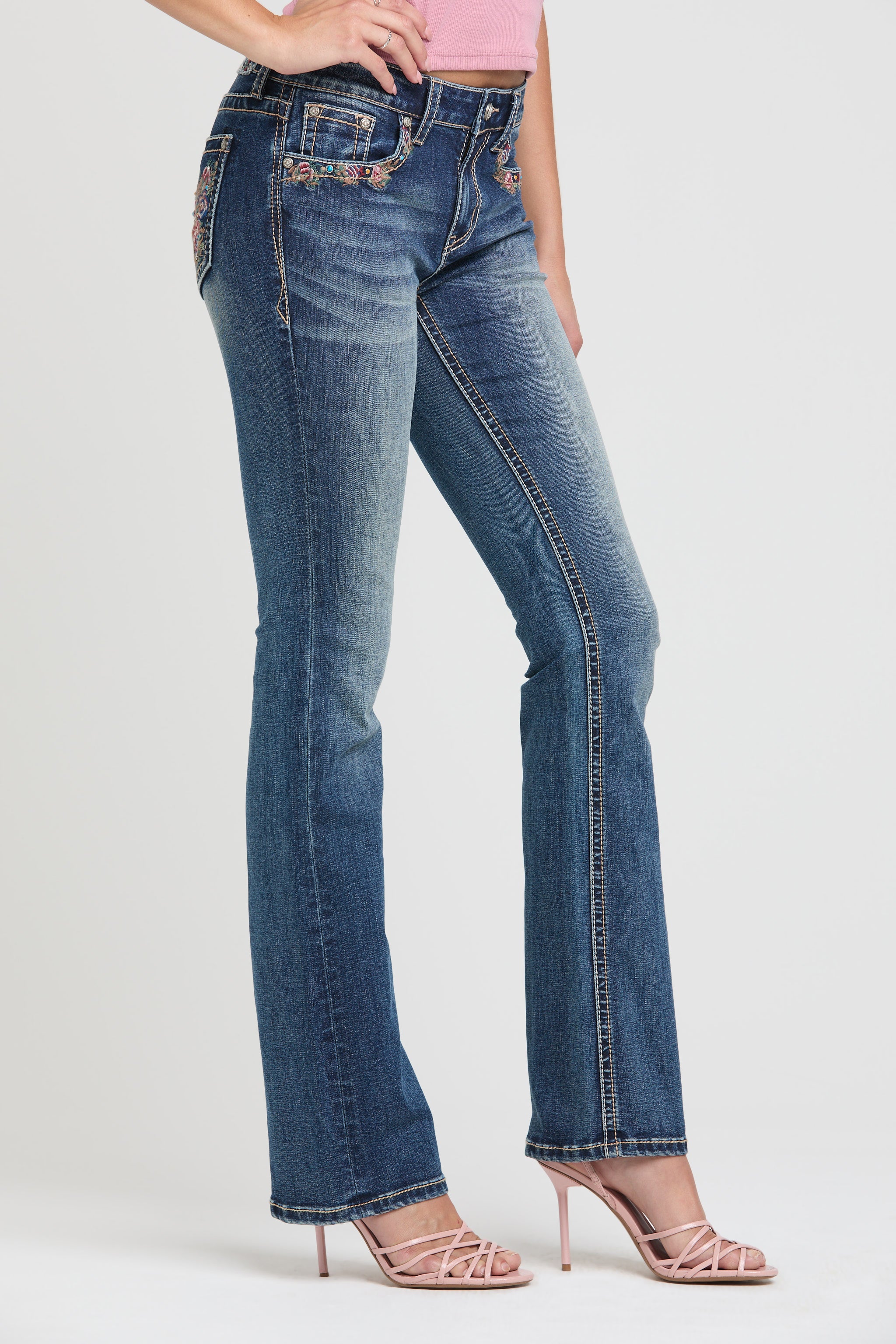 Womens bootcut jeans Side full-length profile highlighting the pink floral pocket embroidery on Grace in LA.