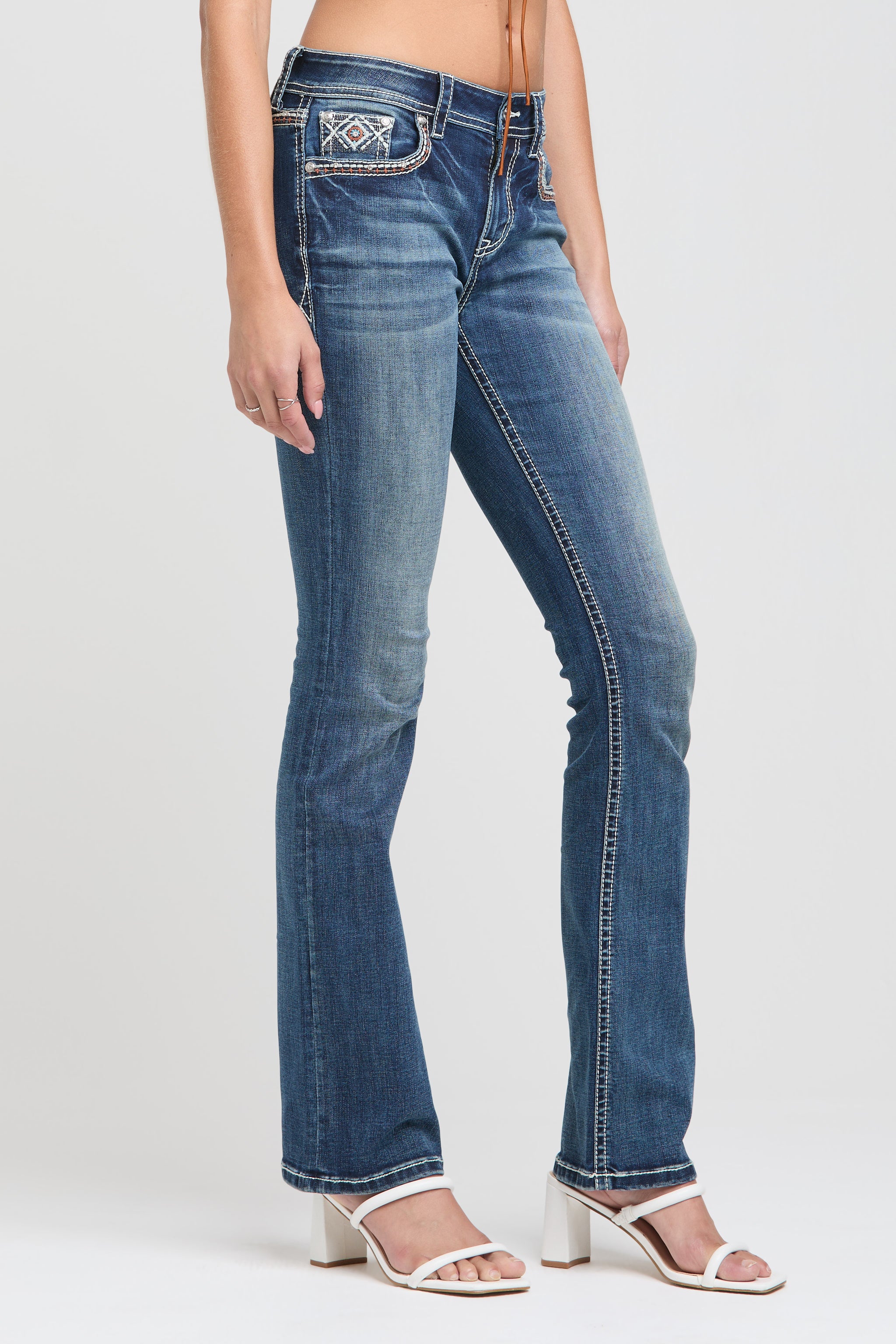 Grace in LA womens low rise jeans with western embroidered front pocket and slim flare silhouette.