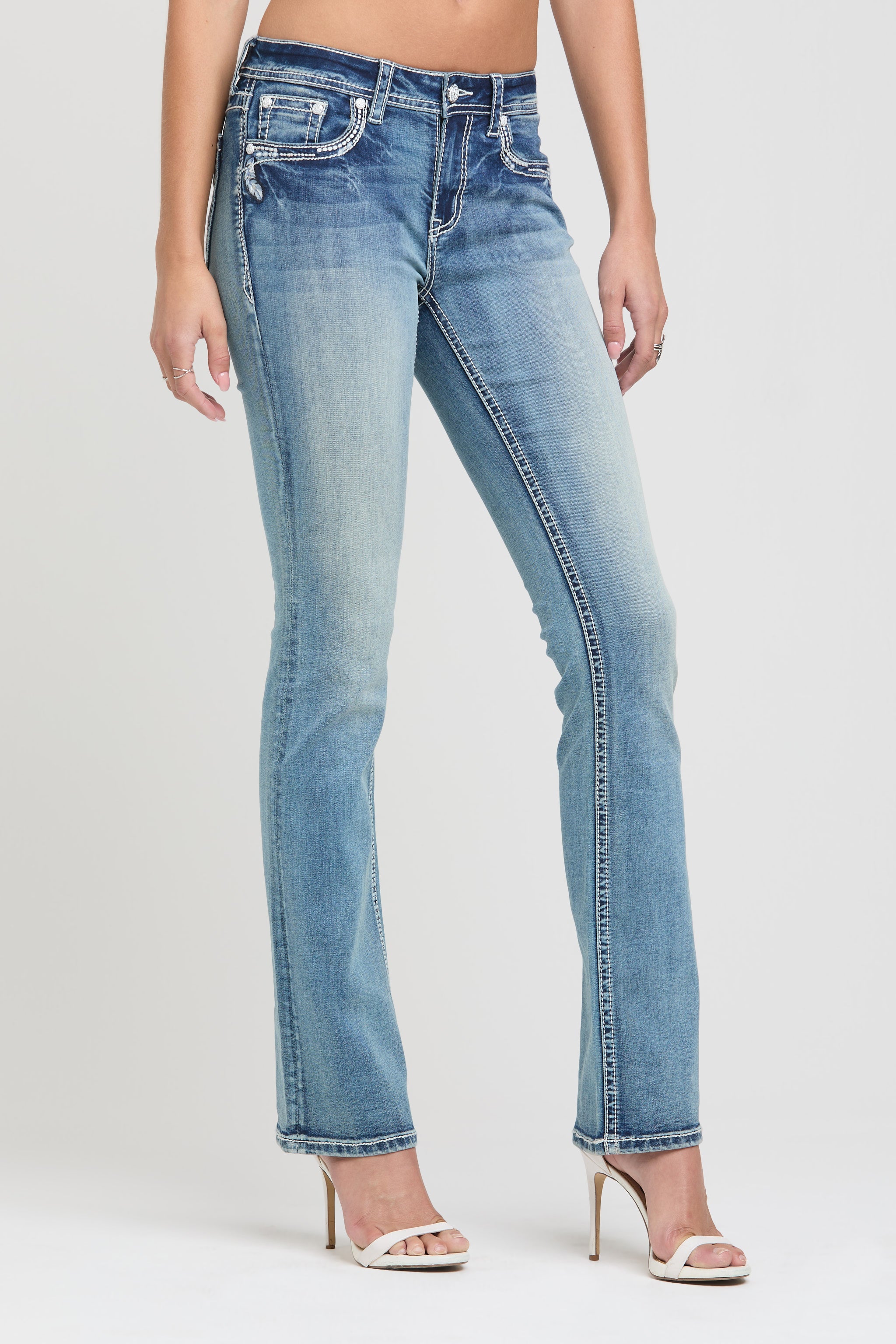 Grace in LA womens flare jeans featuring western embroidered cowboy boot-inspired stitching along the side leg.