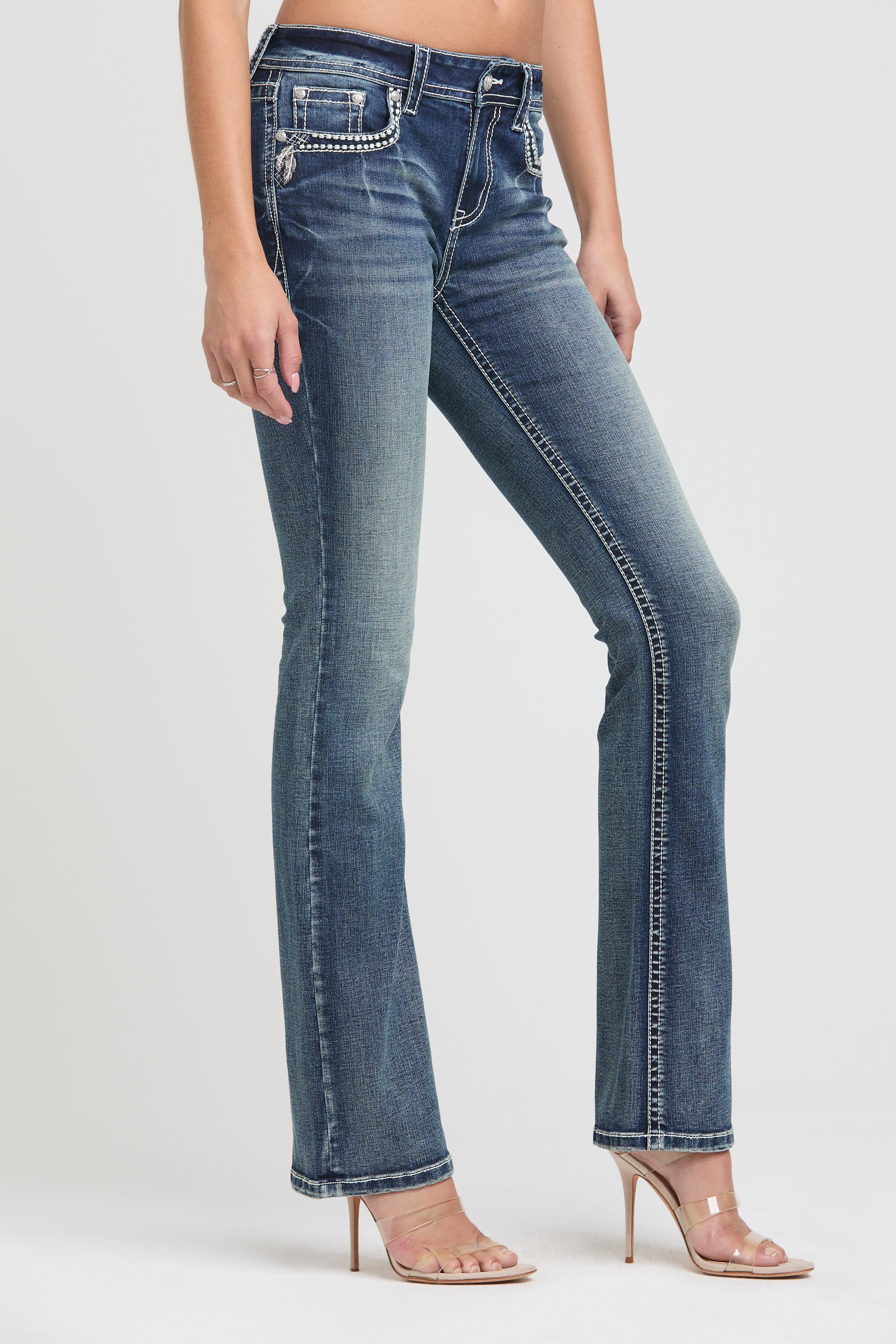 Grace in LA embroidered jeans women in a dark wash flare fit featuring an ornate western dreamcatcher design on the back pockets.