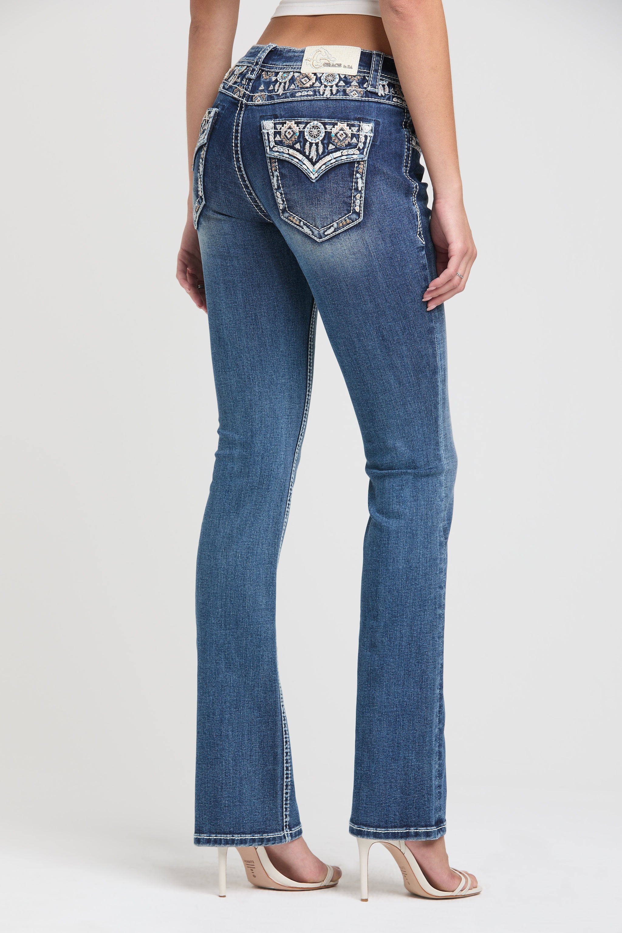 Grace in LA Women's Western Bootcut Jeans - Full Back View showing Dreamcatcher Pocket Design and Aztec Waistband Detail