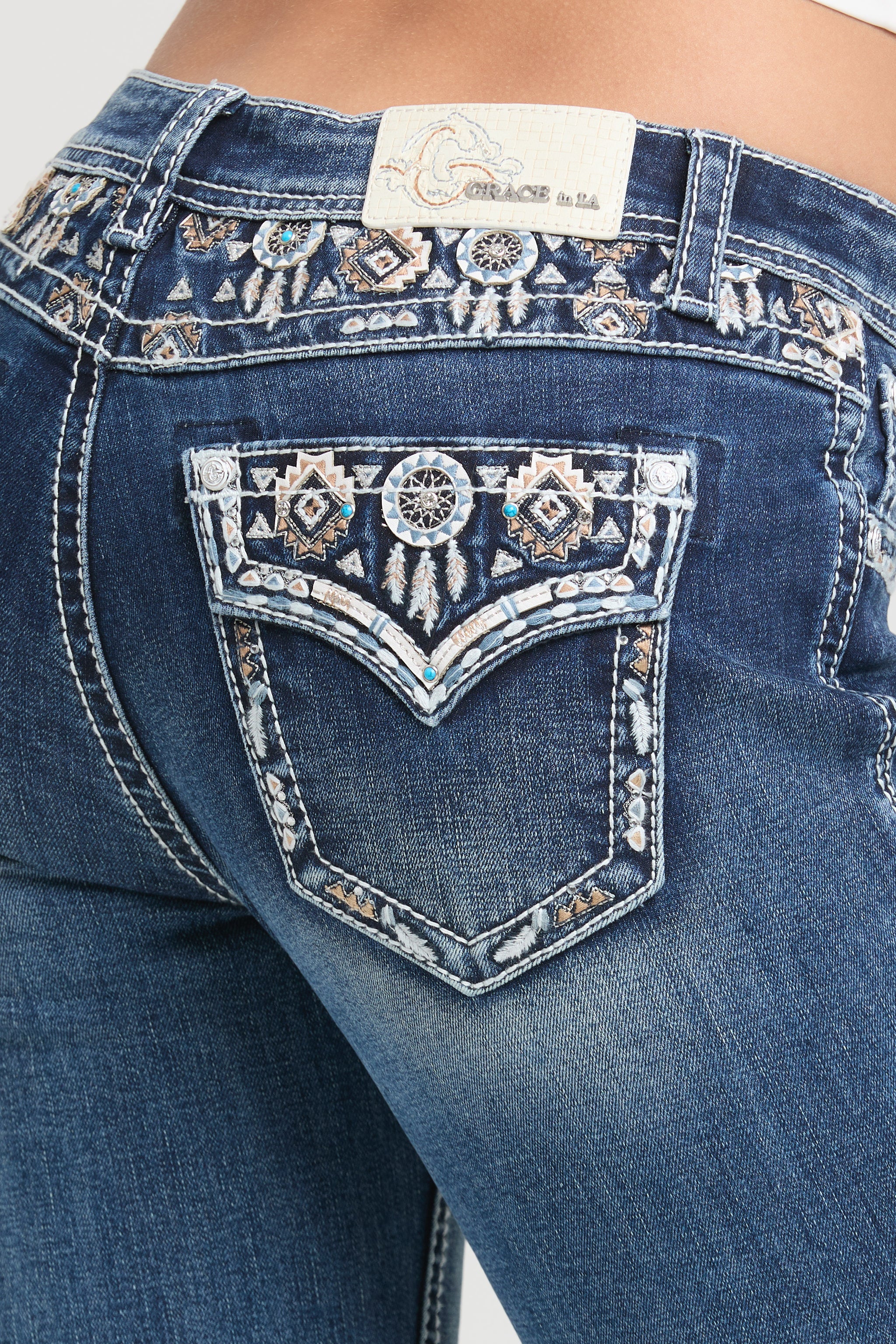 Grace in LA Women's Western Jeans - Close-up of Back Pocket with Dreamcatcher Embroidery and Aztec Pattern Detailing