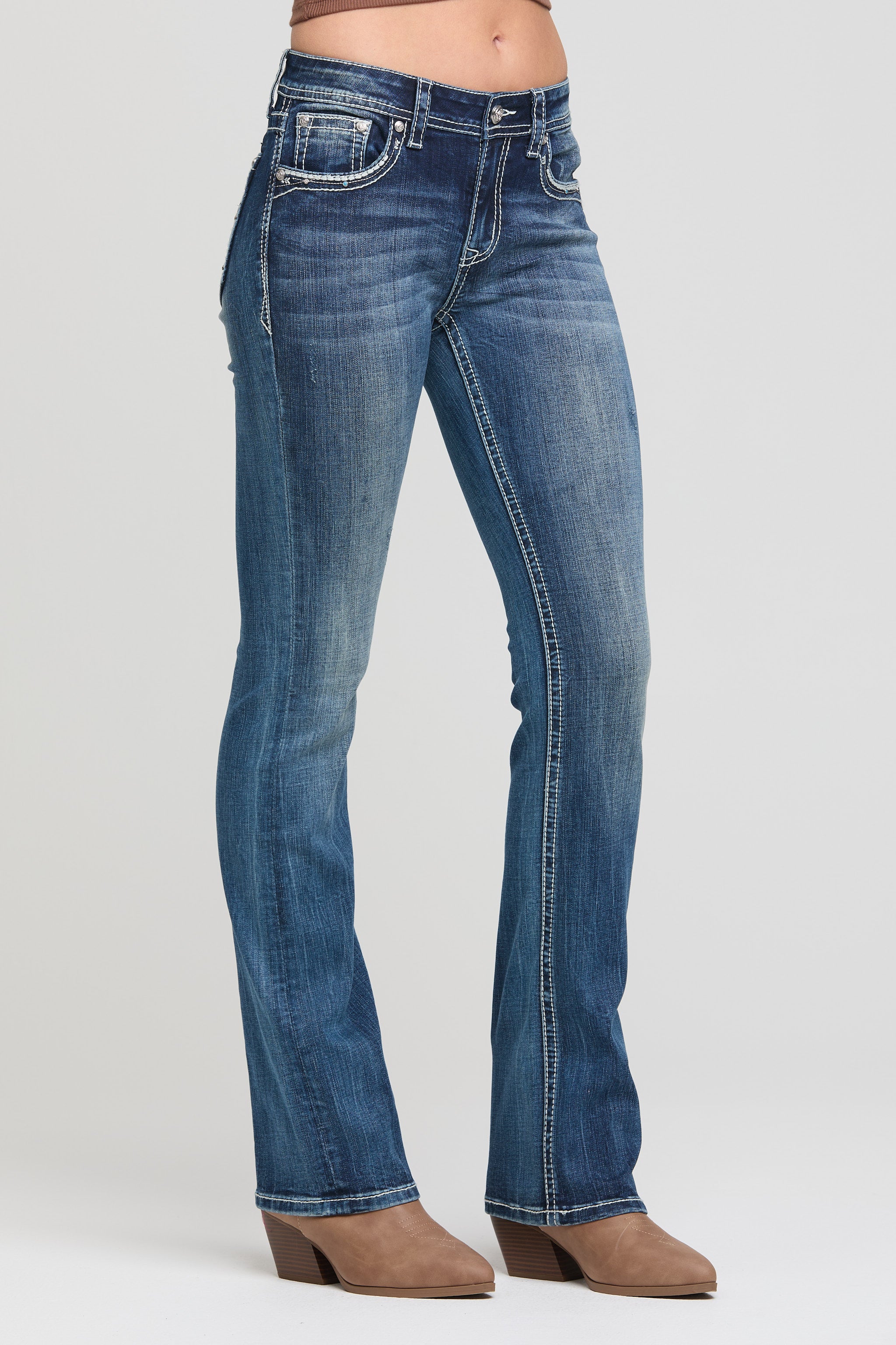 Grace in LA women’s low rise bootcut jeans front angle view with stretch denim fit and whiskering