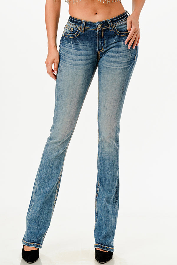 Grace in LA rhinestone jeans for women featuring colorful geometric tribal embroidery with crystal studs on the back pocket and waistband.