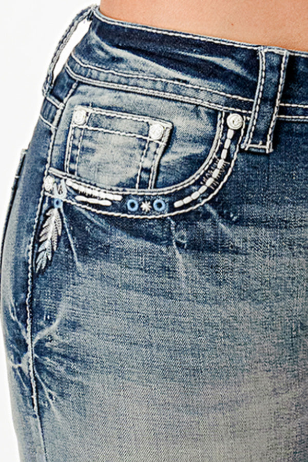 Grace in LA embroidered jeans women featuring a silver feather motif and light blue western embroidery along the front pocket curved seam.