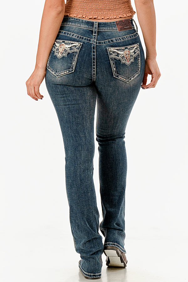 Grace in LA womens bootcut jeans featuring western-style winged embroidery and rhinestone detailing on the back pockets.