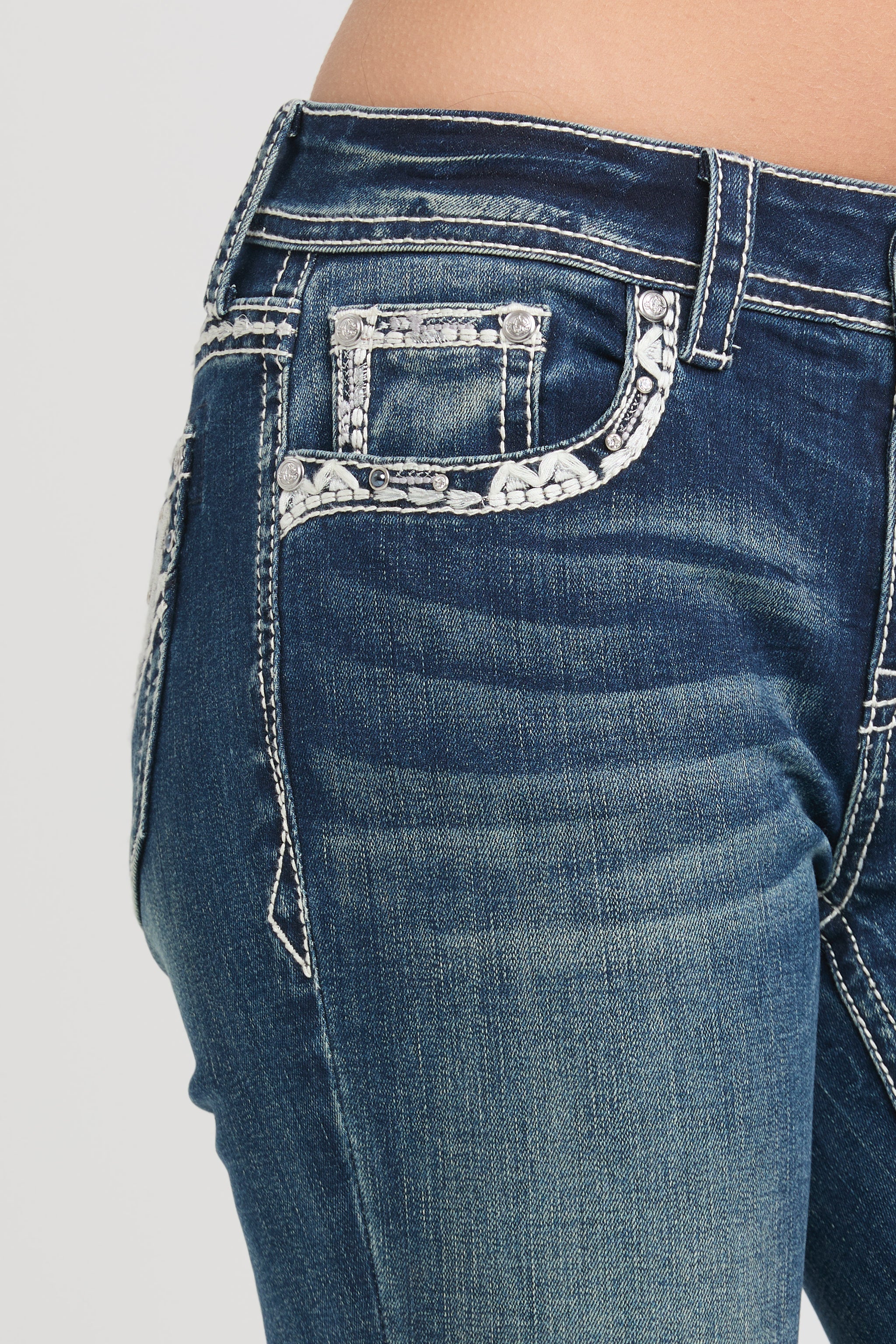 Grace in LA embroidered jeans women featuring a vibrant floral bouquet design on the back pocket with a branded "Grace" leather waist patch.