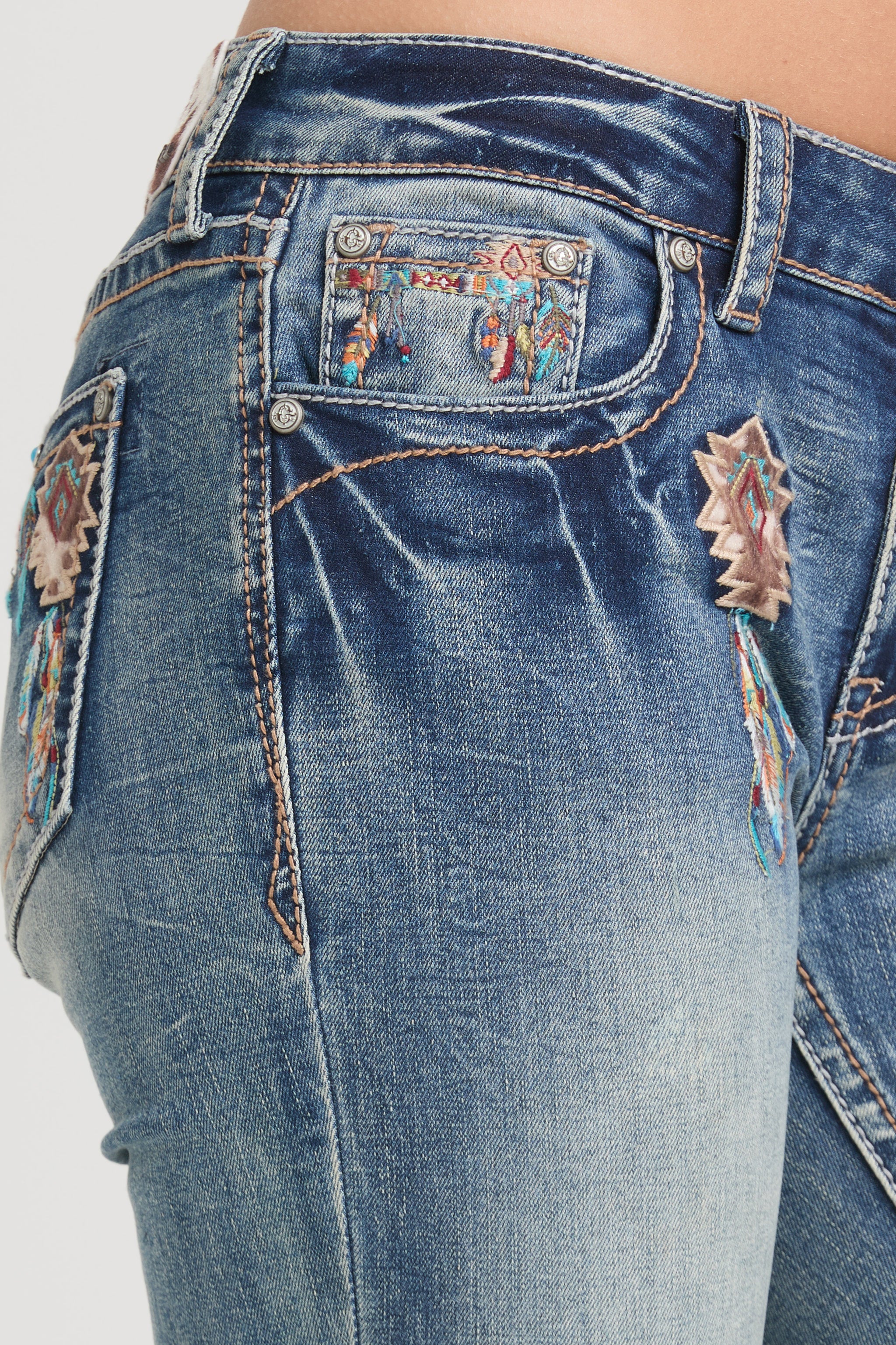 Grace in LA womens bootcut jeans with western embroidered southwestern diamond patches on hip and front pocket.