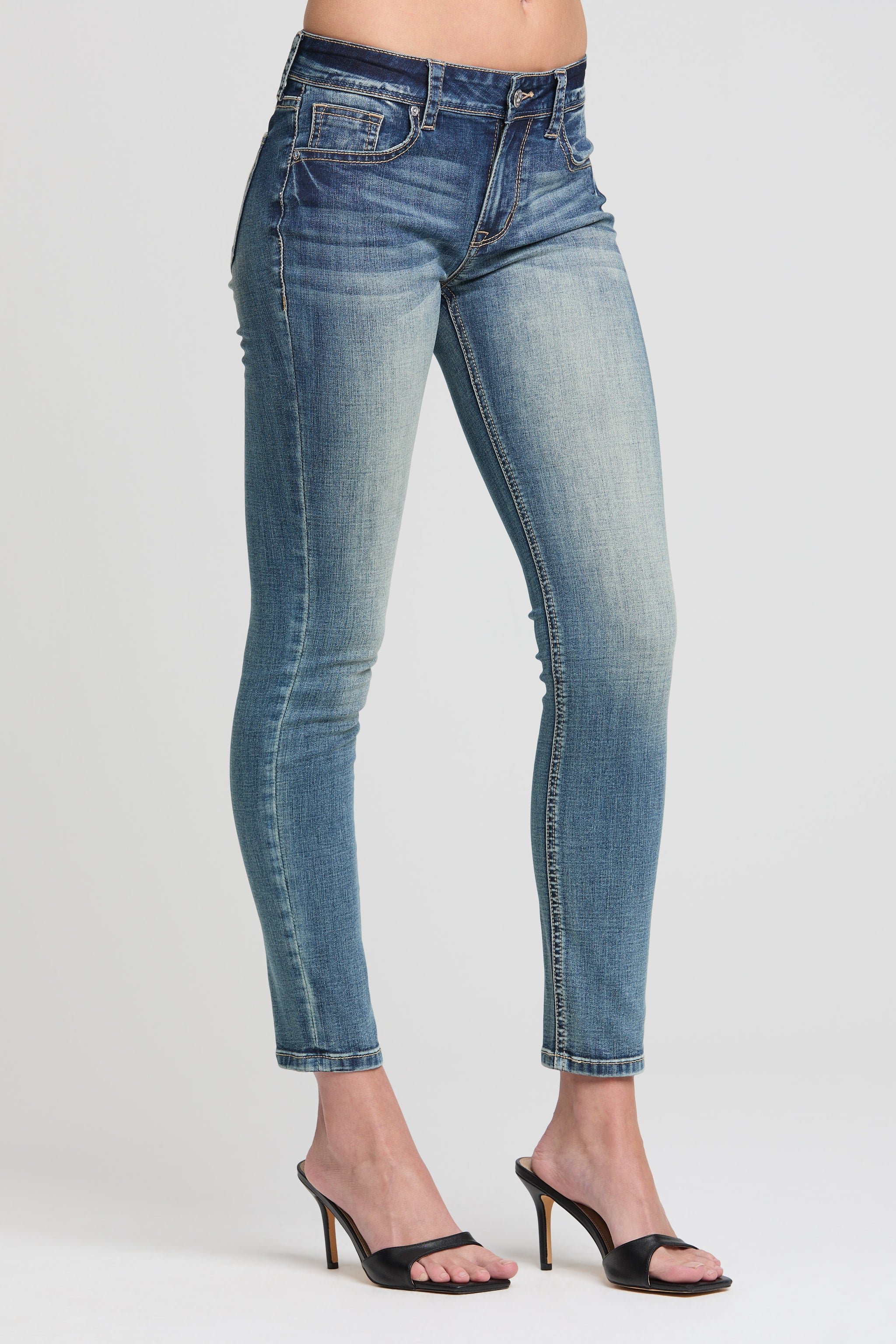 Grace in LA women’s light wash skinny ankle jeans front angle with whiskering and contrast stitch detail