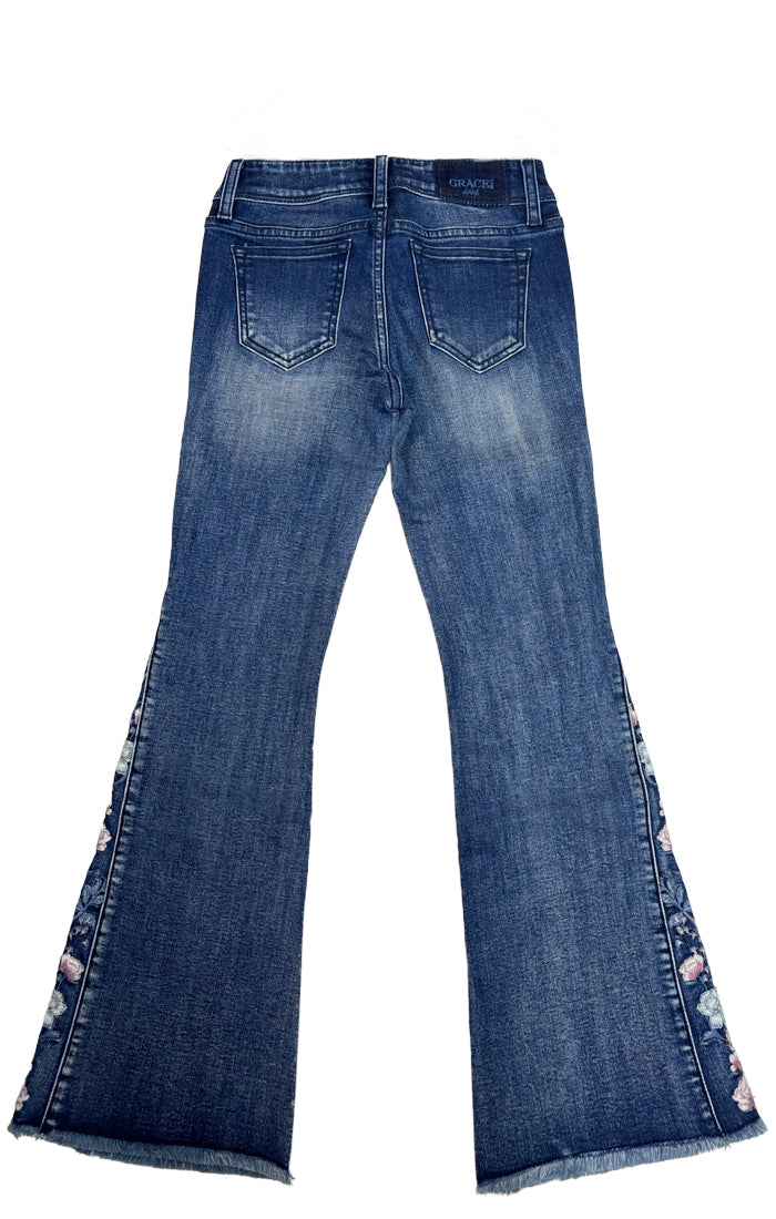 Grace in LA womens bootcut jeans in a faded blue denim finish with heavy whiskering and silver rhinestone hardware.