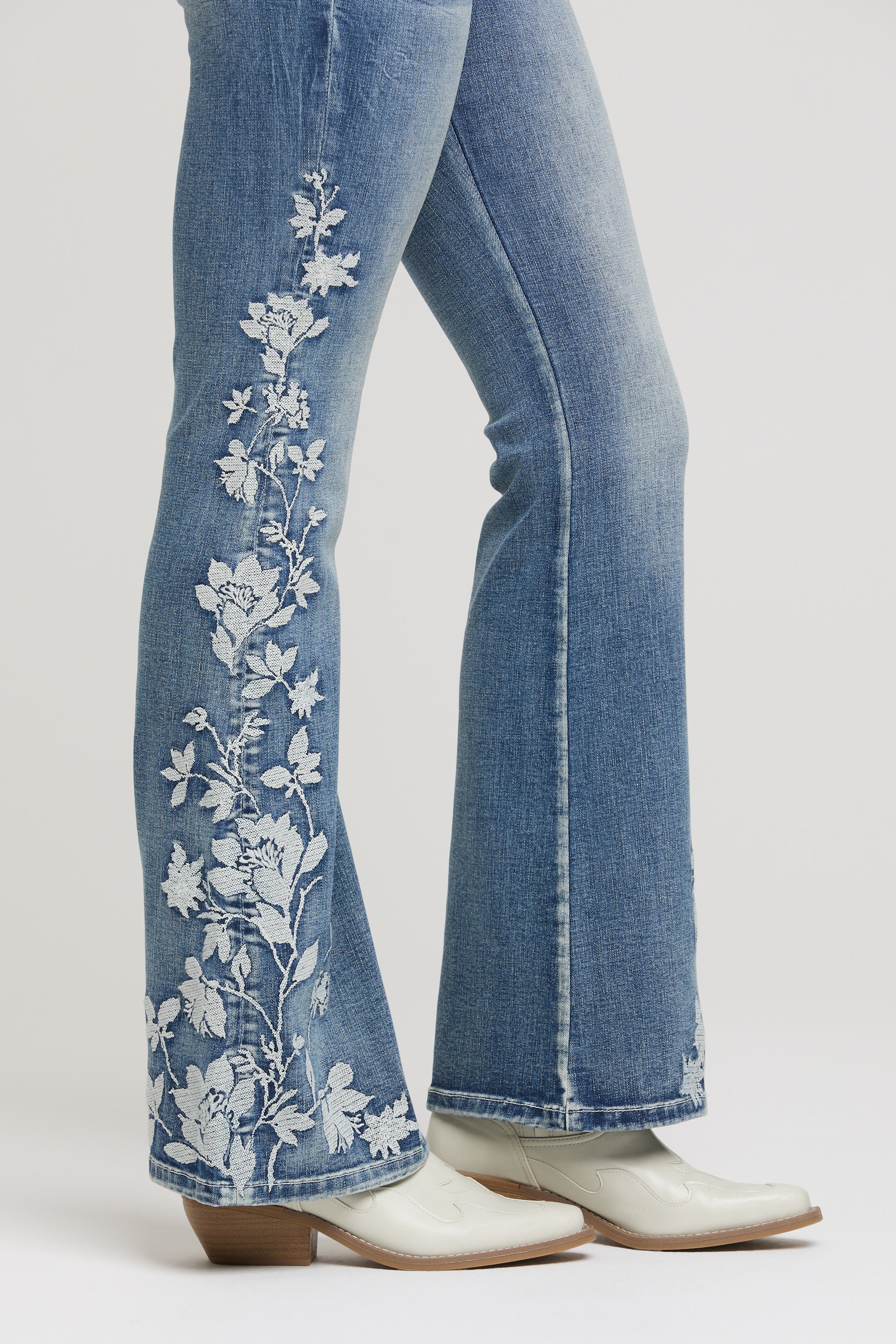 Grace in LA Women's Flared Jeans with White Floral Embroidery - Close-up Side View Western Denim