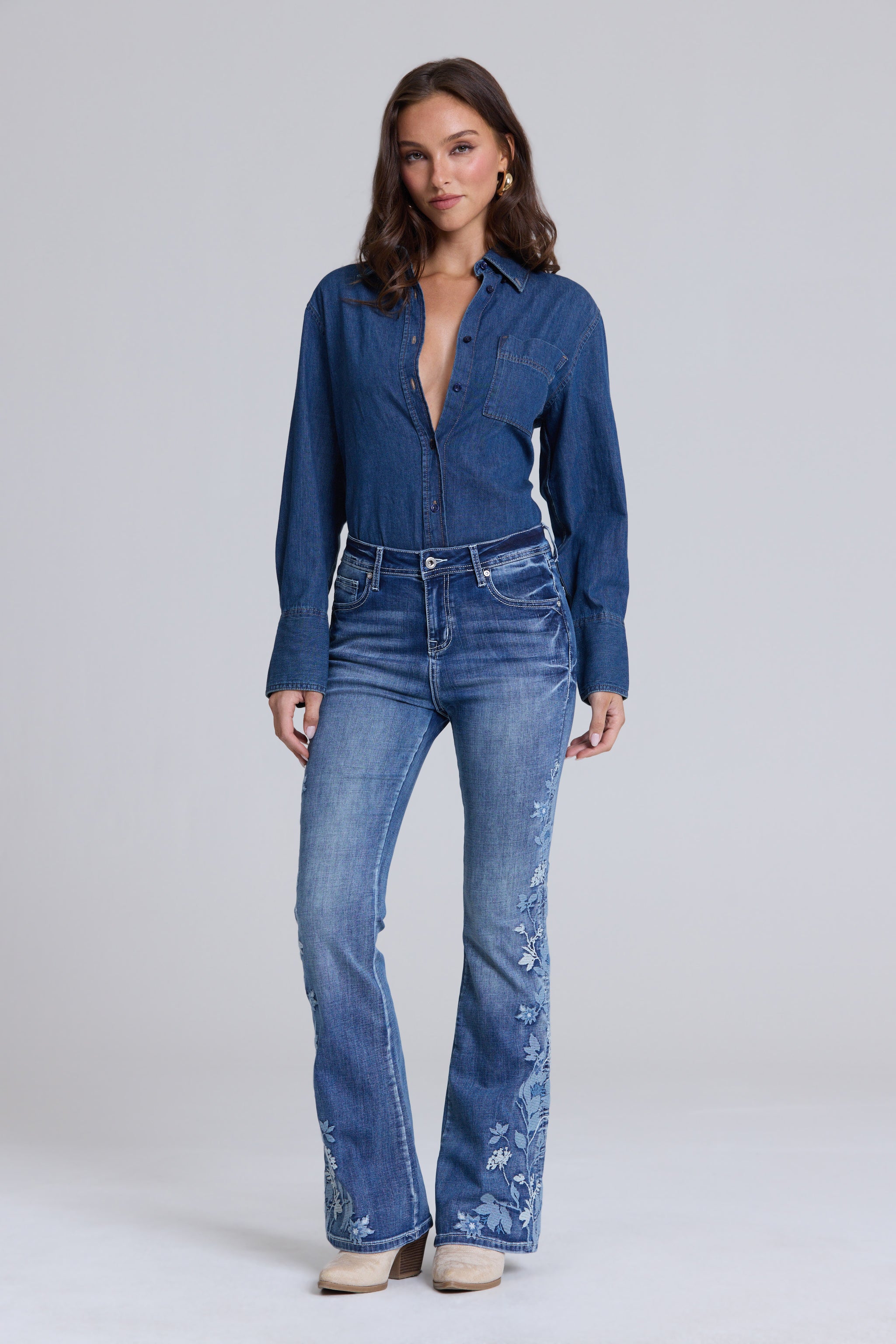 Grace in LA women's medium wash flare jeans full rear view with symmetrical floral embroidery on both back pockets