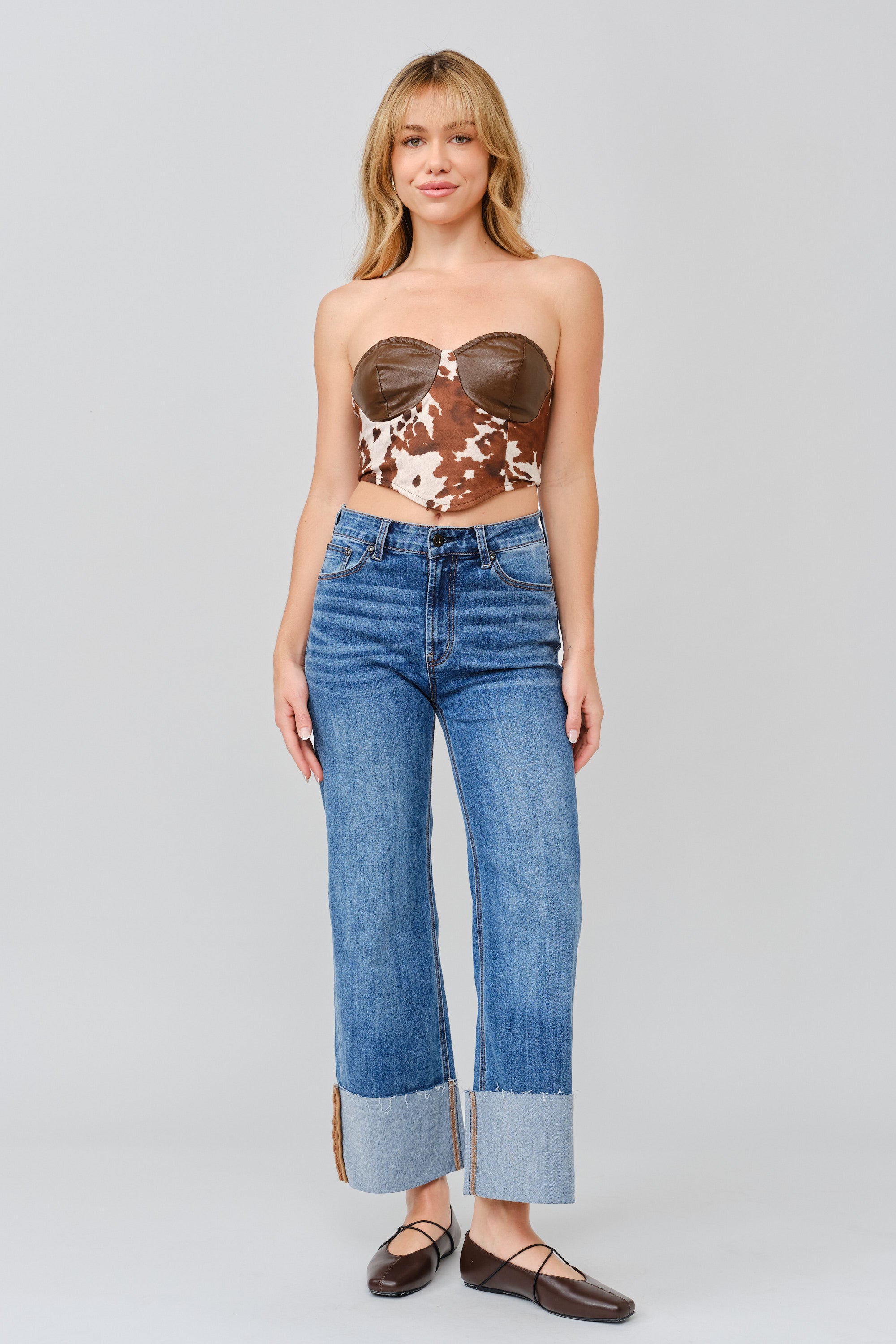 Grace in LA women's medium wash flare jeans styled with a fitted silhouette and flared leg