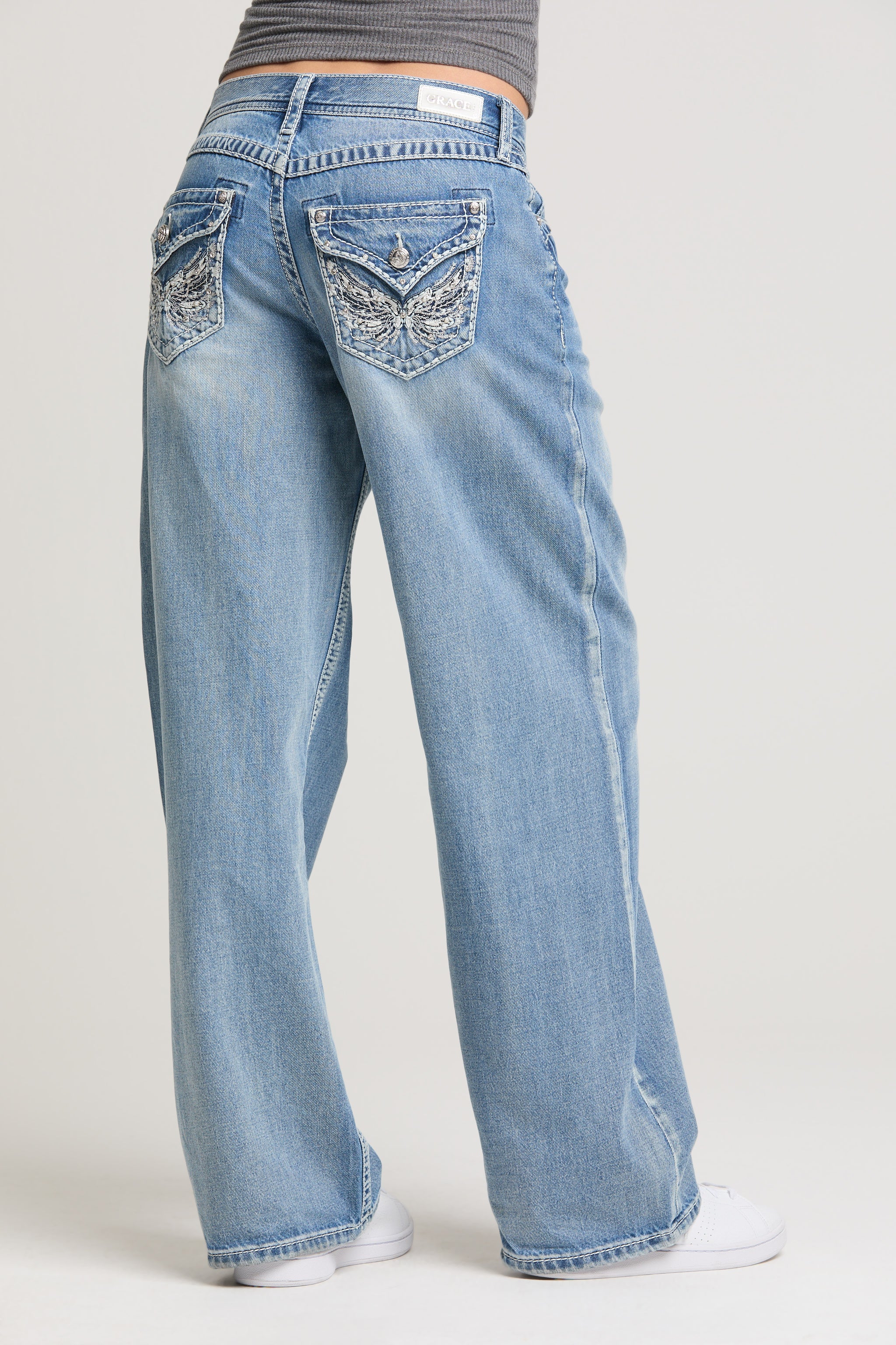 Grace in LA women’s light wash wide leg jeans with decorative back flap pockets