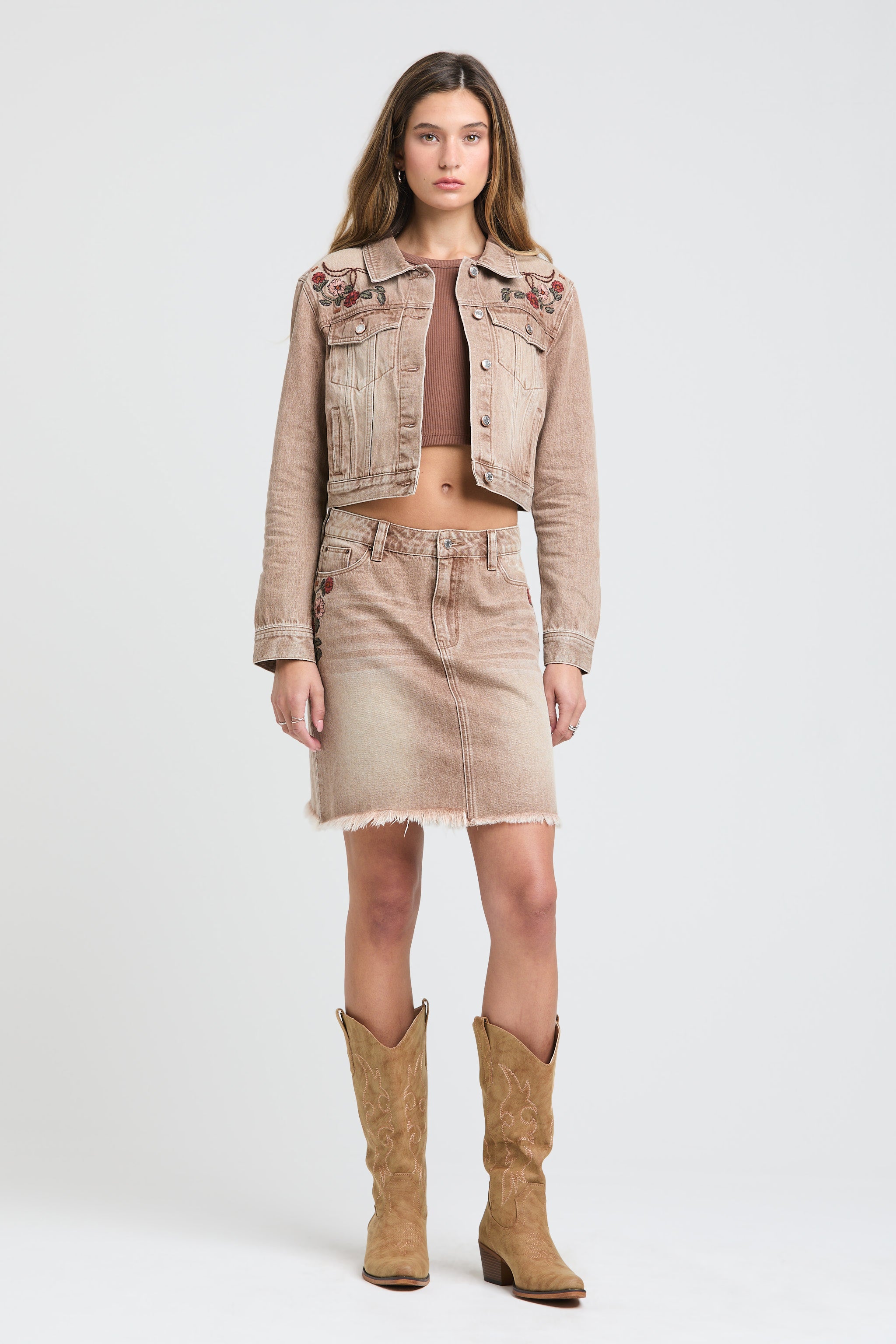 Grace in LA western embroidered beige denim jacket and mini skirt set with cowboy boots for women.