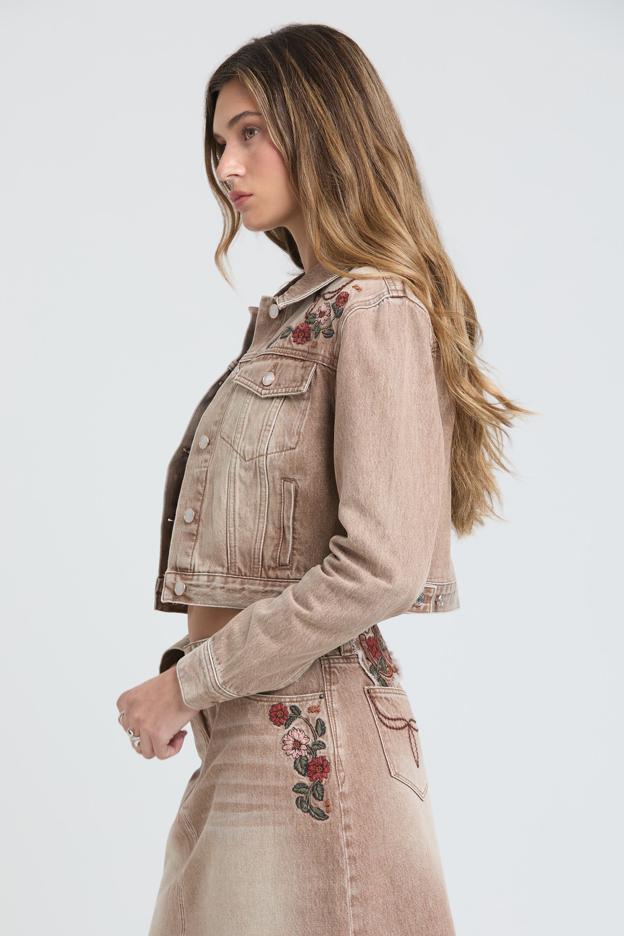 Grace in LA western denim jacket featuring detailed pink and red floral embroidery on the shoulder.