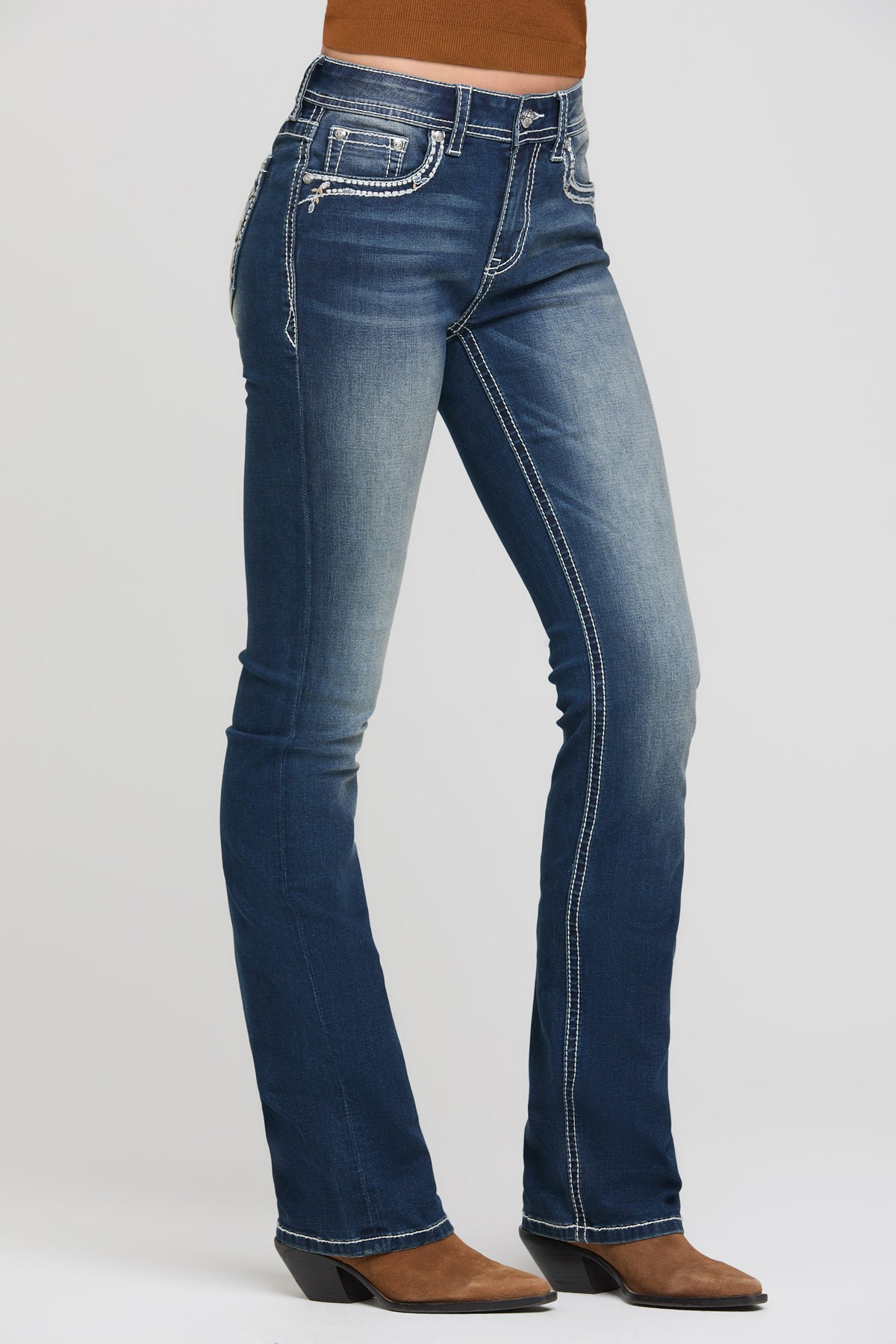 Grace in LA bootcut jeans full rear view with cross and floral appliqué on both back pockets
