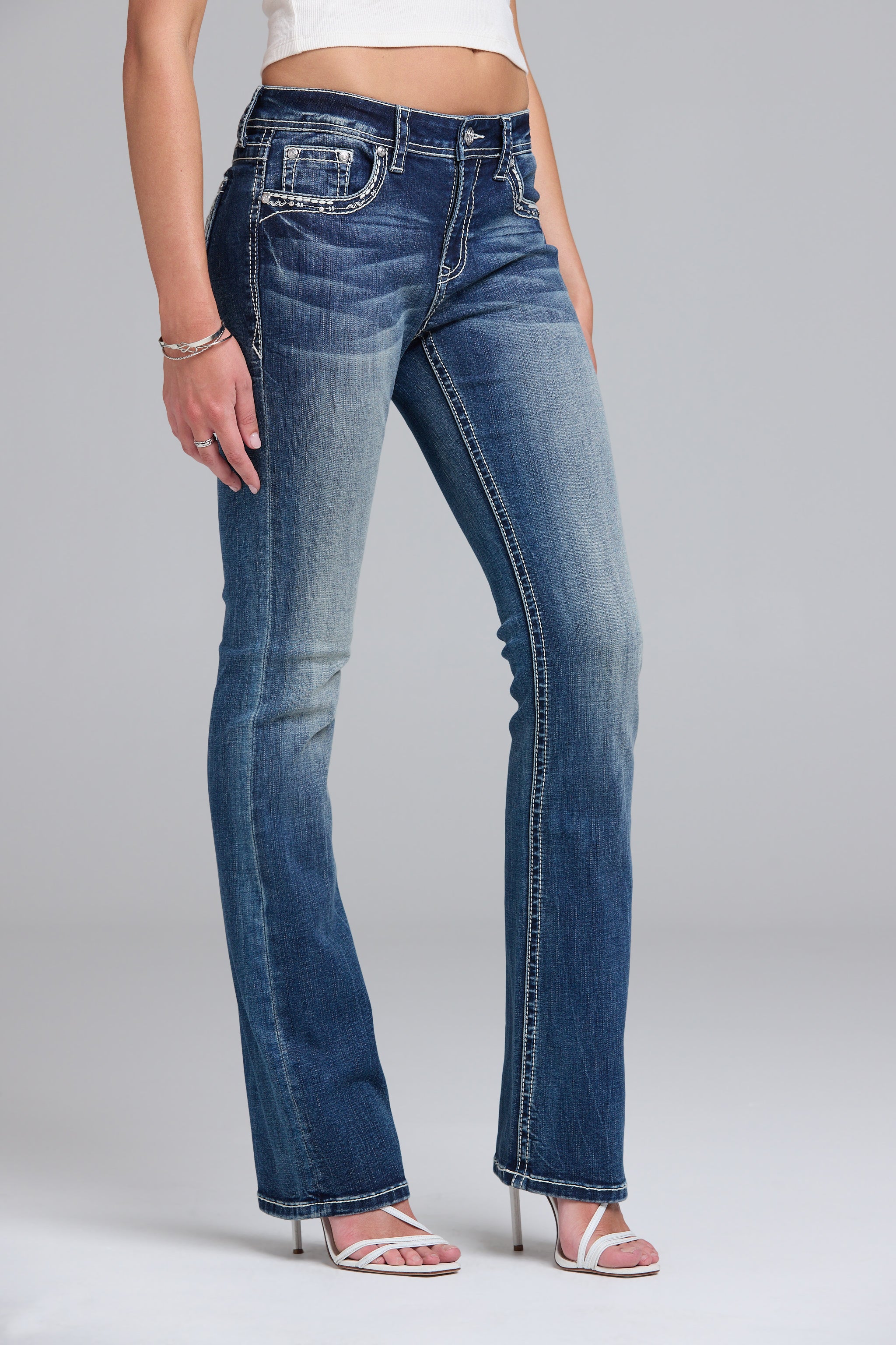 Grace in LA women's medium wash wing embroidered bootcut jeans styled for a western-inspired look