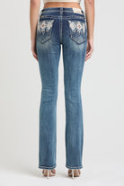 Grace in LA womens bootcut jeans with southwest arrow embroidered rhinestone back pockets.