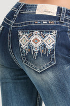 Grace in LA rhinestone jeans for women featuring white and copper tribal diamond embroidery with crystal accents on the back pocket.