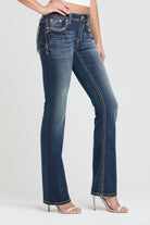 Grace in LA womens bootcut jeans in a dark featuring western-inspired side seam embroidery, cowgirl aesthetic rhinestone details, and a high rise fit.