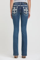 Grace in LA womens bootcut jeans in a dark wash featuring symmetrical white embroidered crosses with turquoise crystal accents on both back pockets.