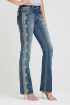 Grace in LA embroidered jeans women featuring a vertical silver lace-inspired floral design along the side outer leg.