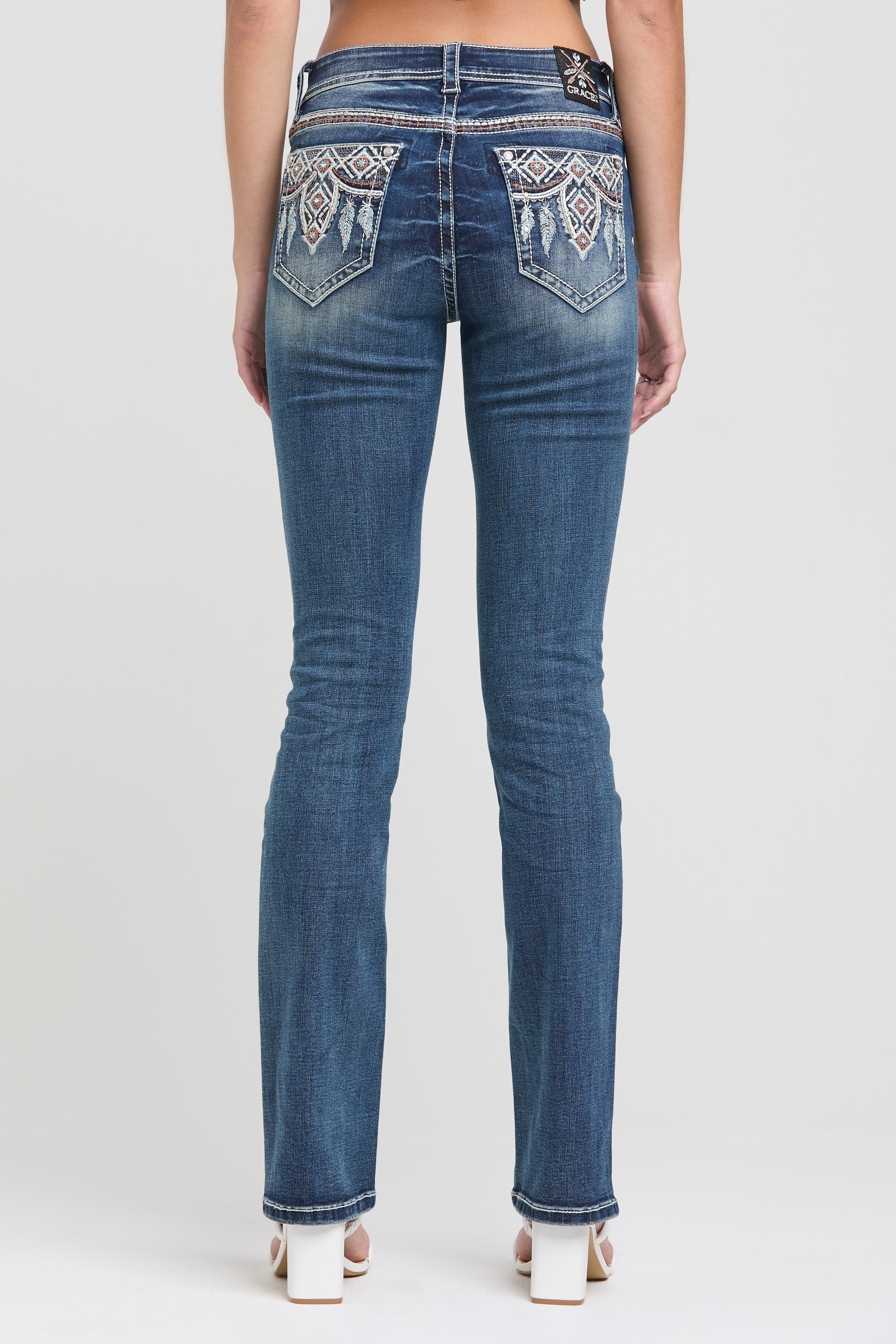Grace in LA womens bootcut jeans in light wash with western rhinestone and pearl embroidered back pockets.