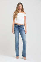 Grace in LA embroidered jeans women featuring a western paisley motif in metallic silver and black stitching with crystal rhinestone on the back pocket.