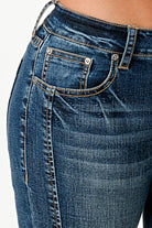 Grace in LA western jeans for women featuring a dark wash with vertical front seam paneling and classic whiskering on the hip.