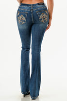 Grace in LA western jeans for women featuring a dark wash bootcut fit and intricate gold paisley embroidery on the back pockets.