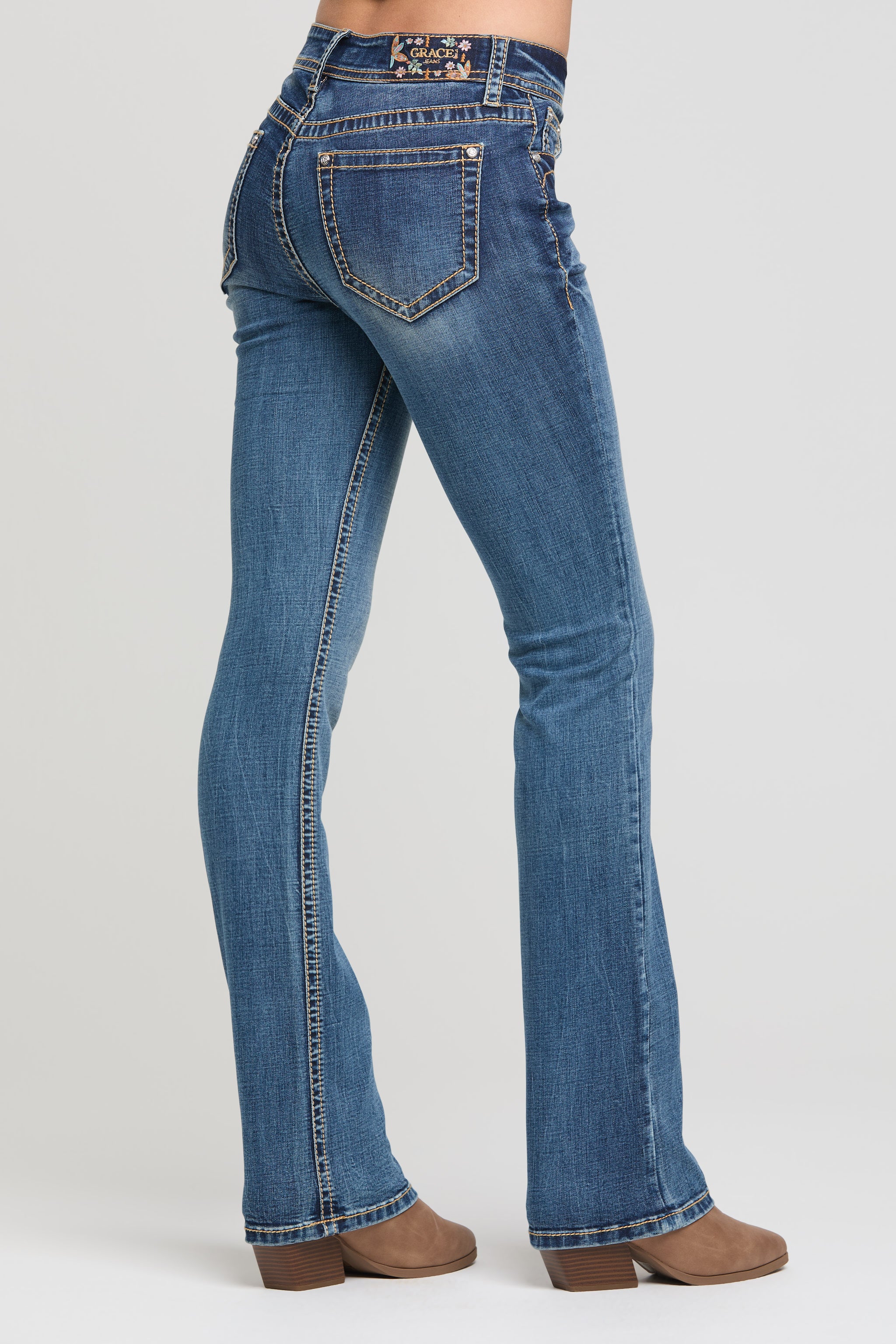Grace in LA basic bootcut jeans back pocket detail on medium wash denim