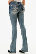 Grace in LA embroidered jeans women featuring a western fleur-de-lis design with light blue rhinestone accents on the back pocket and a white brand patch.