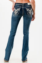 Grace in LA womens bootcut jeans in a dark wash with a slim fit, showcasing white contrast stitching on the side seams.