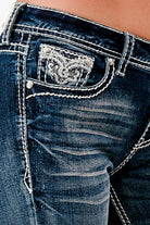 Grace in LA rhinestone jeans for women featuring white crystal-embellished western scroll embroidery on the front coin pocket.