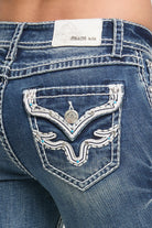 Grace in LA women's medium wash bootcut jeans, close-up side view showing western white border pocket embroidery