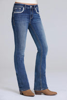 Grace in LA bootcut jeans close-up of colorful dreamcatcher feather embroidery on medium wash denim