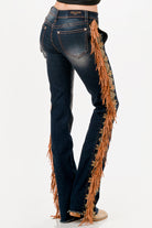 Grace in LA womens bootcut jeans in a dark featuring western-inspired tan fringe and gold embroidery along the entire outer side seams.