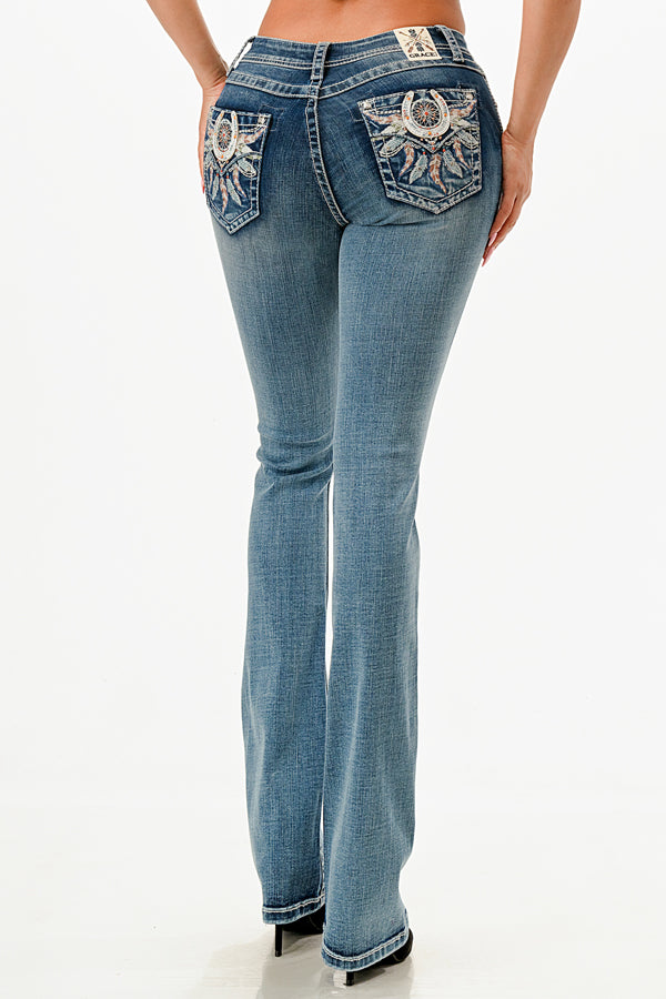 Grace in LA embroidered jeans women in a bootcut silhouette featuring a blue and white feathered dreamcatcher design on the back flap pockets.