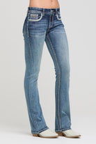 Grace in LA women's medium wash western embroidered bootcut jeans styled for a casual look