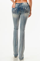 Grace in LA embroidered jeans women featuring a cream and tan floral vine pattern across the back yoke and flap pockets with a white leather brand patch.