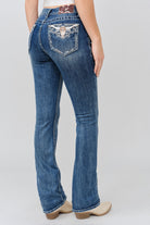 Grace in LA medium wash bootcut jeans back pocket detail with steer head embroidery, rhinestones, and horse hide inset