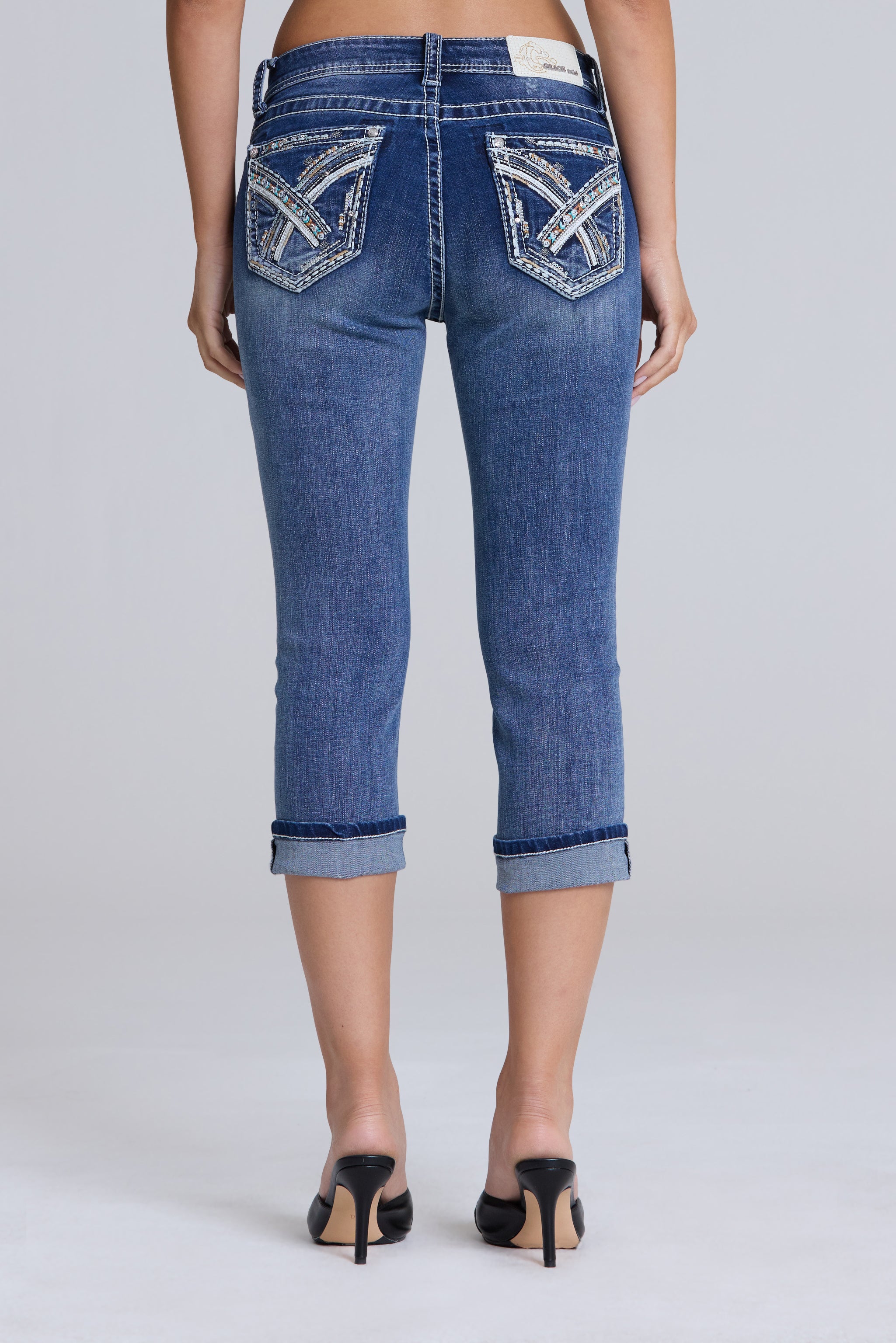 Grace in LA women's medium wash geometric embroidered capri jeans styled for a casual western-inspired look