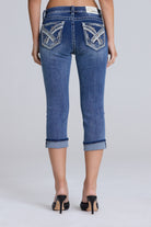 Grace in LA women's medium wash geometric embroidered capri jeans styled for a casual western-inspired look